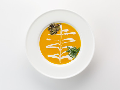 Pumpkin cream soup with fried pumpkin seeds