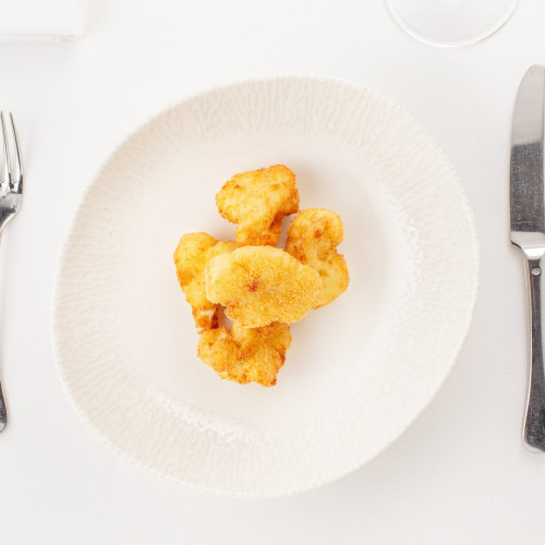 Цветная капуста, жаренная
в сухарях